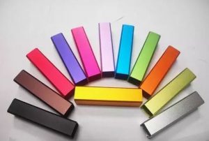 Various anodized aluminum color samples showing Type II finish options including red, blue, gold, black, and clear