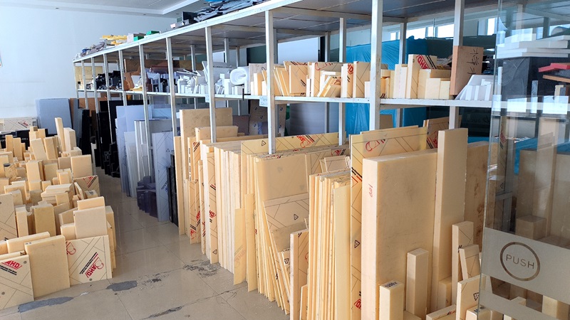 Engineering plastic material storage at RpProto — stocked ABS, POM, PC, Nylon and PEEK sheets for CNC machining prototypes