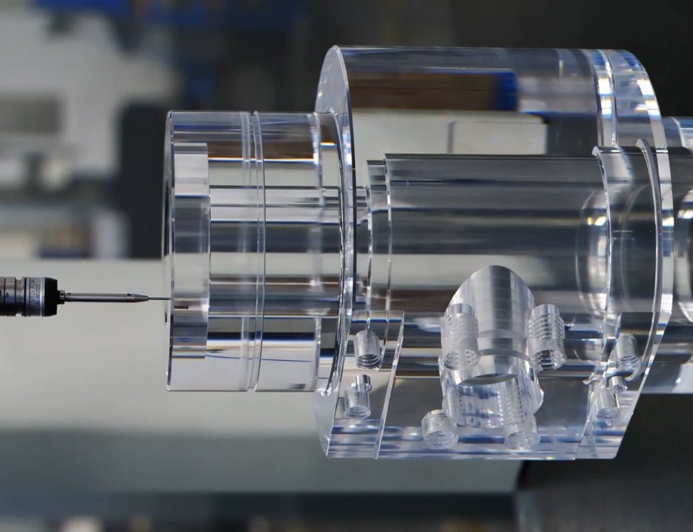 CNC machined clear acrylic PMMA valve body prototype — precision machined at RpProto