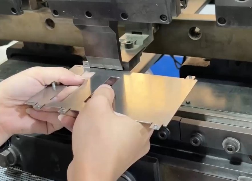 CNC press brake bending aluminum sheet metal panel to custom angle specifications